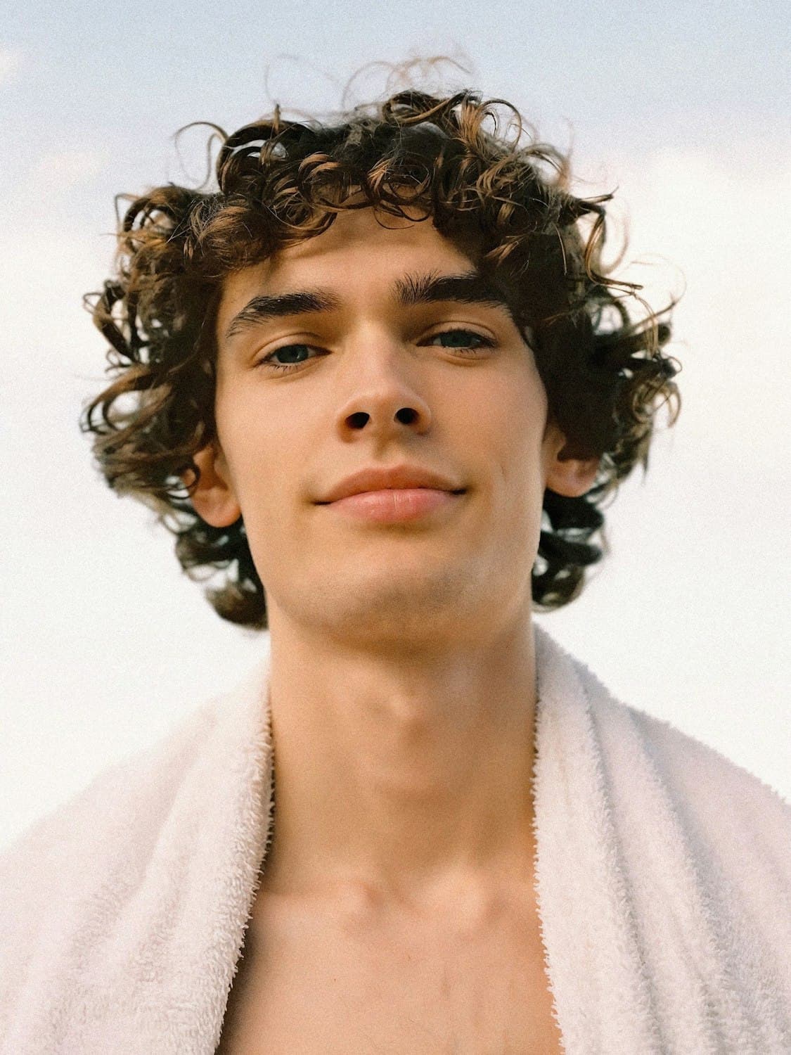 Portrait of Jordan Reyes with loose brown curls